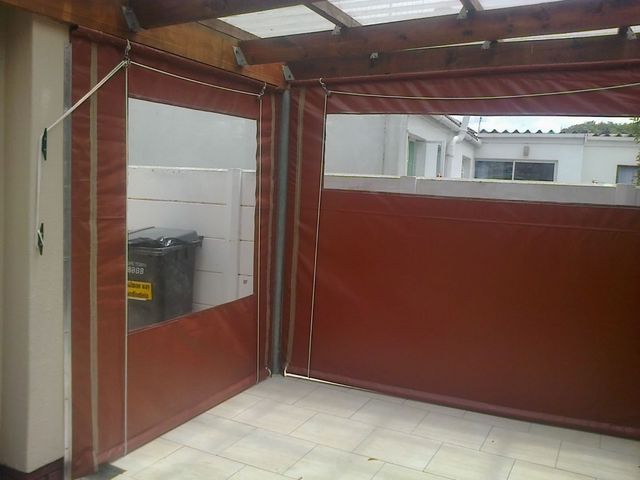 burgendy PVC outdoor blinds with windows